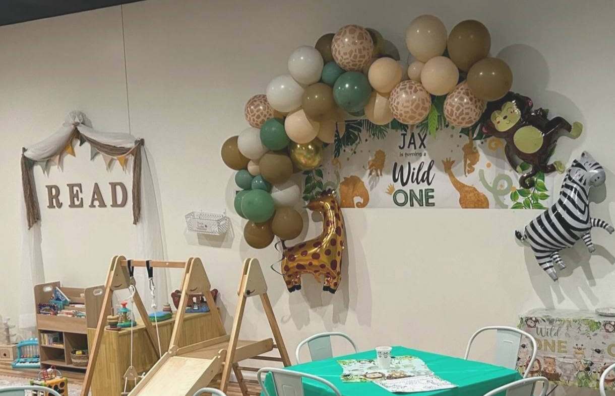 A jungle-themed first birthday party set up in the Little Lions Den play space